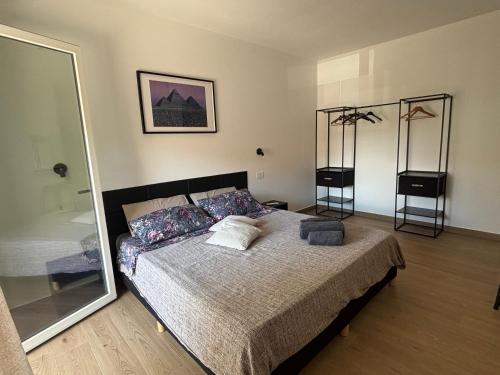 a bedroom with a bed and a large mirror at Serendipity in Elmas