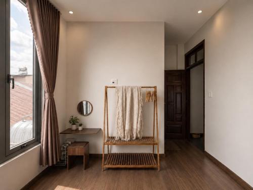 a dressing room with a mirror and a window at 1 House 2 in Da Lat