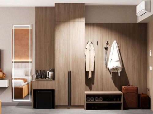 a room with a room with a bed and a room with at Urban Hotel Ethno in Bishkek