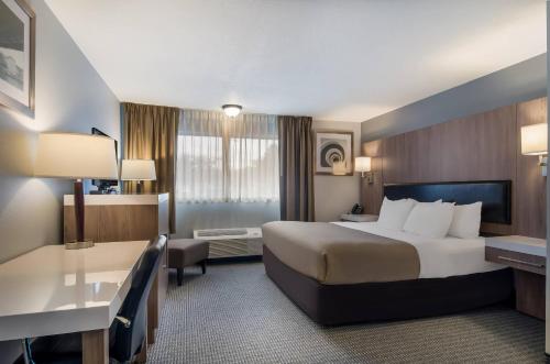 a hotel room with a bed and a desk at Quality Inn & Suites Silverdale Bangor-Keyport in Silverdale