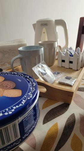 a table topped with blue and white plates and a mixer at B&B SoleMare in Taranto