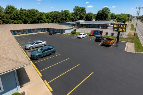 an overhead view of a parking lot with cars parked at Relax Inn Dover Near Speedway in Dover