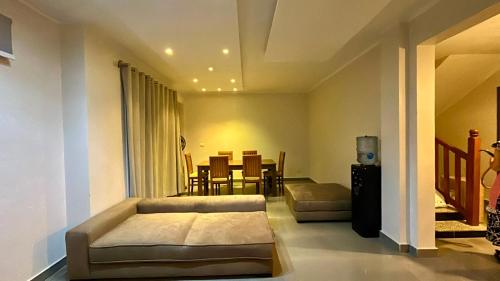 a living room with a couch and a dining room at Sea View 4Bedroom Villa wz Jacuzzi Mountain View Ras Elhikma in Ras Elhekma