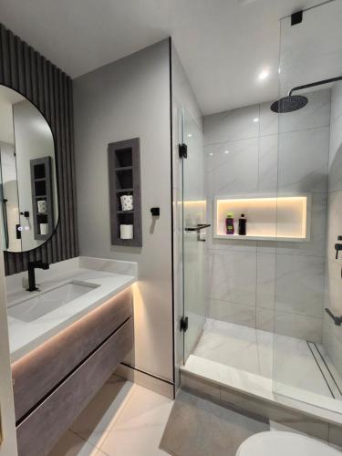 a bathroom with a shower and a sink at Executive Room in North York Centre in Toronto