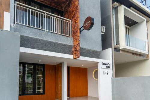 a facade of a building with a balcony at Calma Villa Panorama, Batu Malang in Batu
