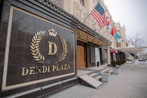 a building with a sign that reads deadil plaza at Dendi hotel bukhara in Bukhara
