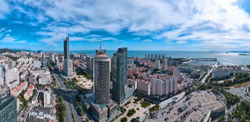 an aerial view of a city with tall buildings at Crowne Plaza Qingdao by IHG in Qingdao