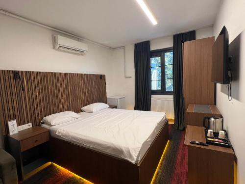 a hotel room with a bed and a window at Vicolo Moda Kadıköy in Istanbul