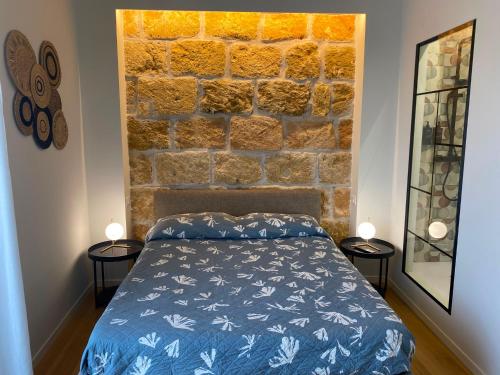 a bedroom with a bed and two side tables at Cavour 106 Apartment in Palermo