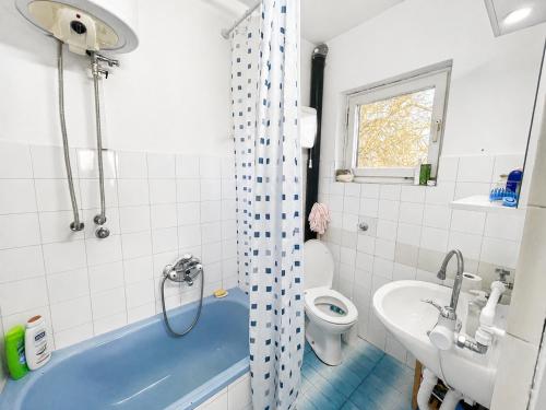 a bathroom with a tub and a toilet and a sink at Takovo Hills in Vrnčani