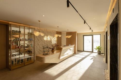 a large room with a store with a window at Doubletree By Hilton Tashkent in Tashkent
