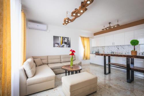 a living room with a couch and a table at Villa Enigma in Gevgelija