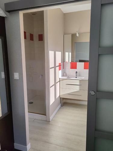 a bathroom with a sink and a shower at Hotel O'Fun Art in Airvault