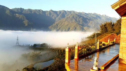 a view of a river with mountains in the background at Sapa Clay House - Mountain Retreat in Sa Pa