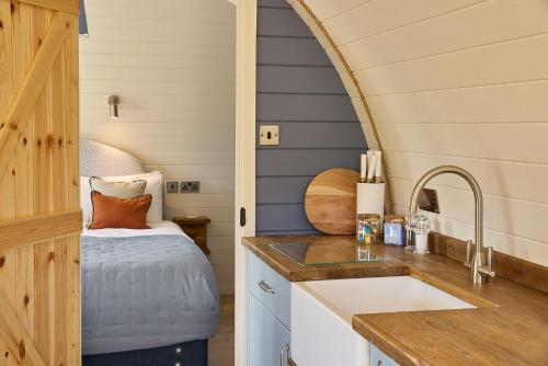 a kitchen with a sink and a counter top at Waters Edge Cabin in Helmsley