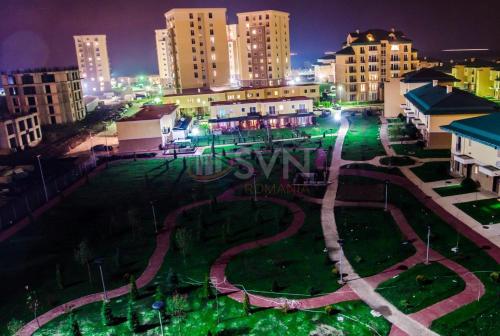 a view of a city at night with buildings at Studio Apartament Cosmopolis P3B in Ştefăneştii de Sus