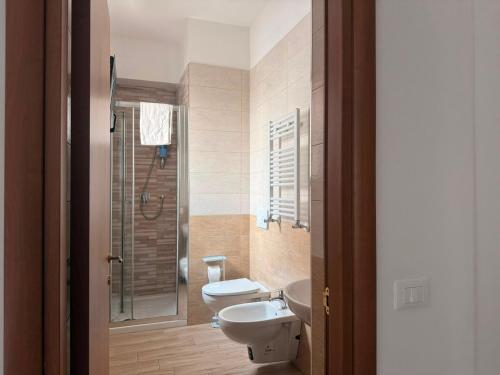 a bathroom with a toilet and a sink and a shower at Casa Raffaella in Polignano a Mare