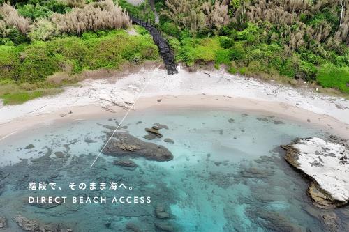 an aerial view of a pool of water on a beach at THE THIRD PLACE tatéyama 楼 in Tateyama