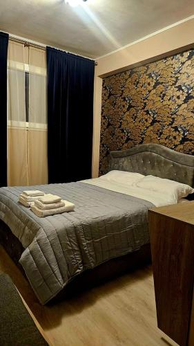a bedroom with a bed with two towels on it at Residence di Raul in Porto Recanati