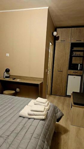 a room with a bed with towels on it at Residence di Raul in Porto Recanati