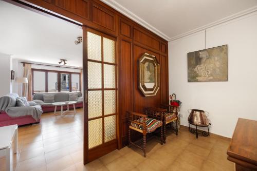 a living room with a couch and a mirror at Vives Ref 9002 in Cala Bona