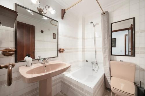 a bathroom with a sink and a tub and a toilet at Vives Ref 9002 in Cala Bona