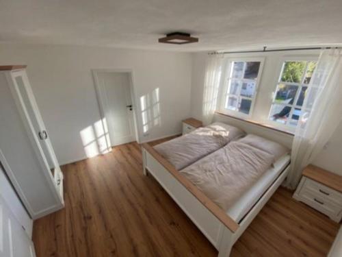 a bedroom with a bed in a room at Rheinhessen Auszeit in Wendelsheim