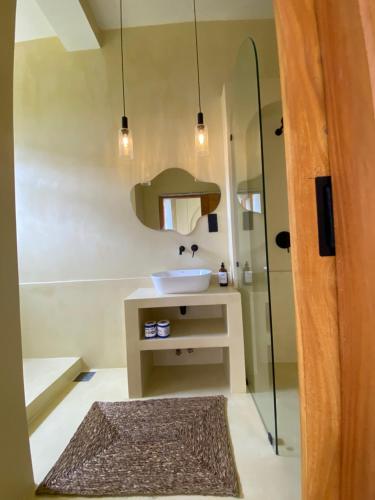 a bathroom with a sink and a shower at Surf'n Lanka - Surf School in Weligama