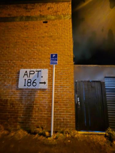 a sign on the side of a brick building at AB Accomodation in Palmerston North