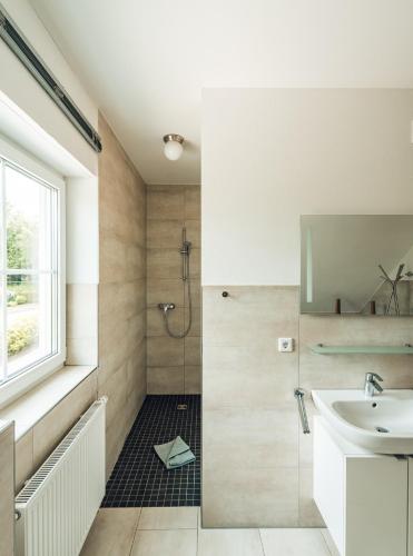 a bathroom with a sink and a shower at Schneekäppchen 2 in Winterberg
