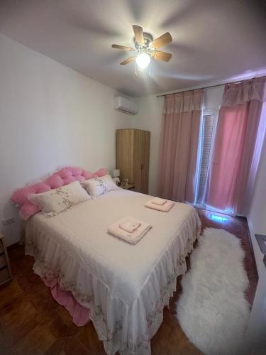 a bedroom with a bed with two towels on it at Villa Julieta in Scalea