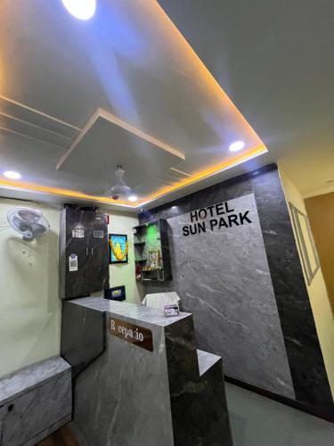 a hotel sun park with a sign on the wall at Hotel Sun Park in Ahmedabad