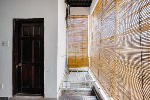 an empty room with a door and a window at Exia House in Ho Chi Minh City