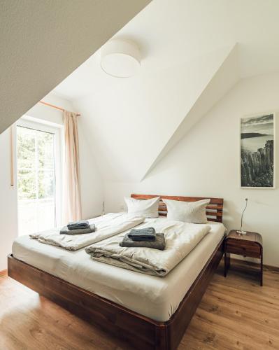 a bedroom with two beds and a window at Schneekäppchen 2 in Winterberg
