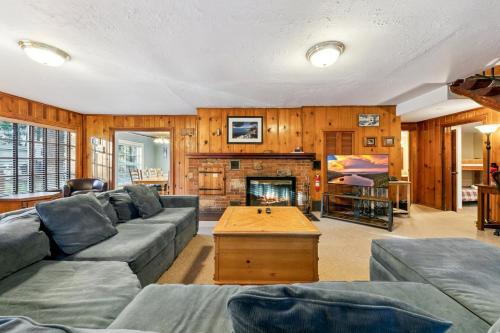 a living room with a couch and a fireplace at 3664 Birch Avenue cabin in South Lake Tahoe