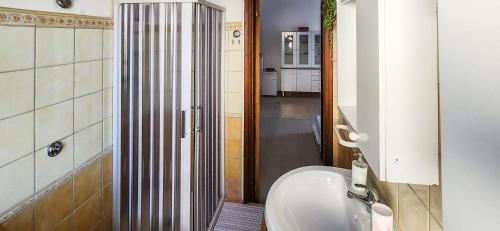 a bathroom with a tub and a toilet in a room at Casa delle Farfalle in Cariati