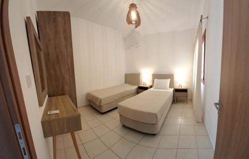 a room with a couch and a bed and a table at Vigla in Spartià