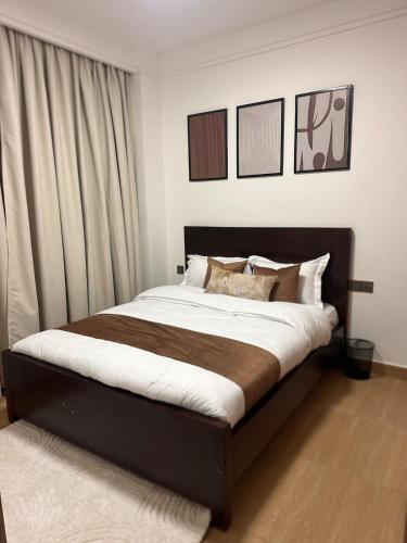 a bedroom with a large bed in a room at Rama Stays in Nairobi