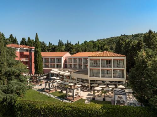 an aerial view of a hotel with tables and umbrellas at Remisens Hotel LUCIJA in Portorož