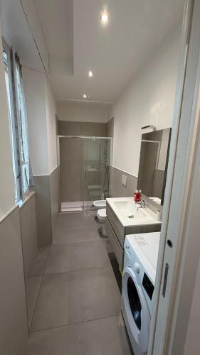 a bathroom with three sinks and a shower at Le Case di Stela in Terni