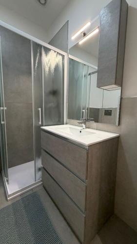 a bathroom with a sink and a shower at La Casa di Stela 2 in Terni