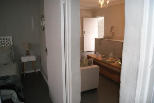 a room with a bathroom with a sink and a counter at Chalet Duiker in Ladismith