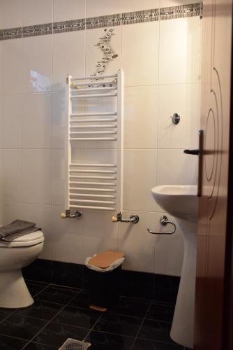 a bathroom with a toilet and a sink at Sxoleio Apartment in Kamariotissa