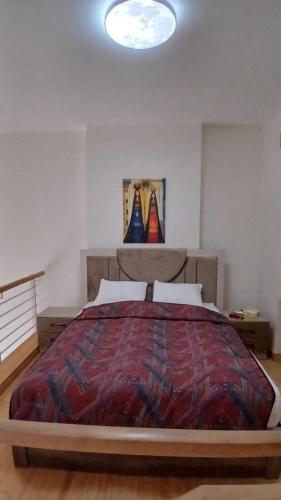 a bedroom with a large bed in a room at Bella by the Sea in Sowayma