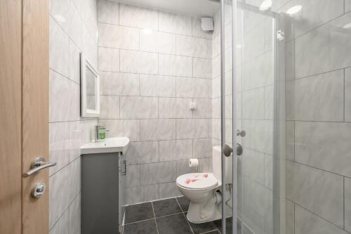 a bathroom with a toilet and a sink and a shower at Bosta Guest House - Private Rooms - Inverness in Inverness