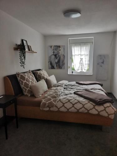 a bedroom with a bed and a window at Auszeit Sauerland in Schmallenberg