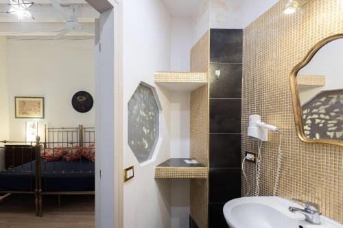 a bathroom with a sink and a mirror at Nel Cuore di Bologna M ,Bologna by Shortholidays in Bologna