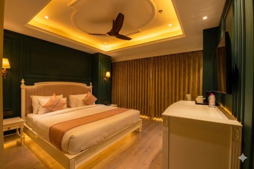 a bedroom with a bed with a ceiling at The Sunder Palace-Jaipur City Centre Hotel in Jaipur