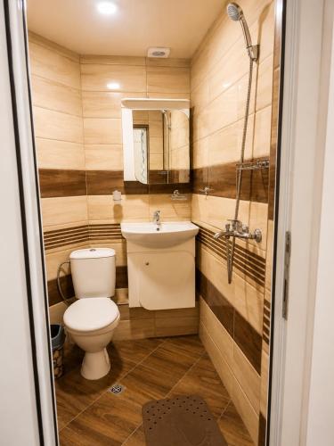 a bathroom with a toilet and a sink at City Centre Room Near Everything in Varna City