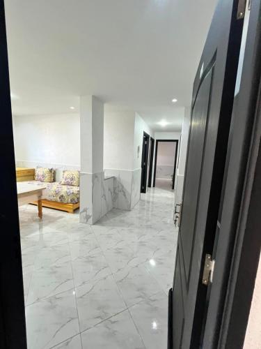 a hallway with a living room with a couch at Dar l Bihar in Al Hoceïma